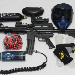 A gun, mask and other assorted gear from the best paintball brands.
