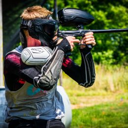 A man aims one of the most accurate paintball guns.
